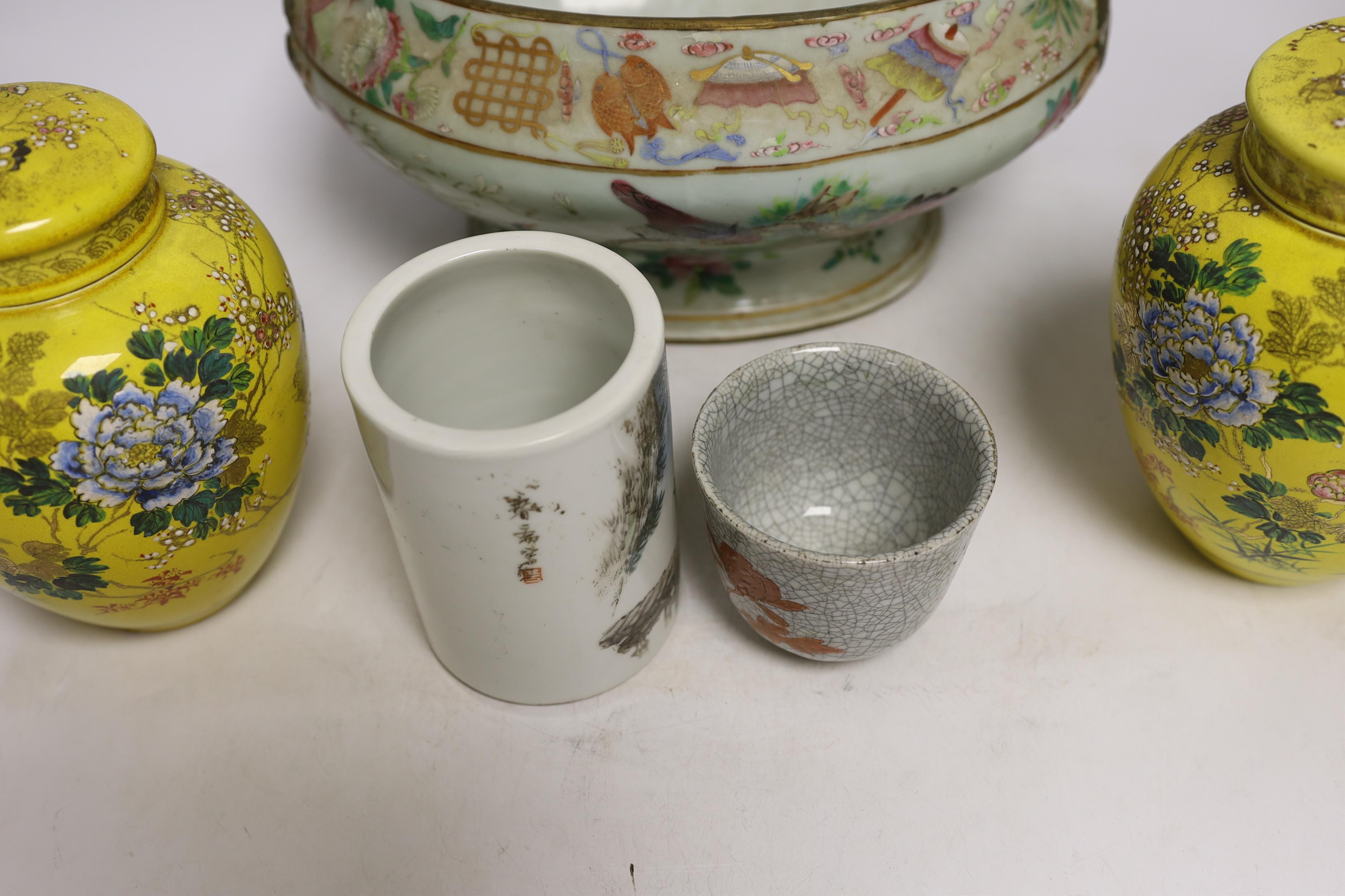 A 19th century Chinese famille rose tureen (lacking cover), a bronze mirror, a brush pot, a crackle glazed teabowl and a pair of Japanese yellow glazed satsuma jars and covers, tallest 18cm (6)